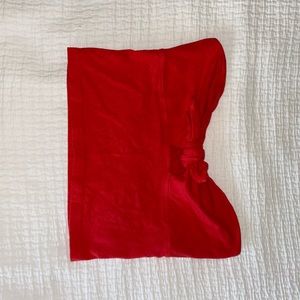 red cropped tube top with tie and cut out